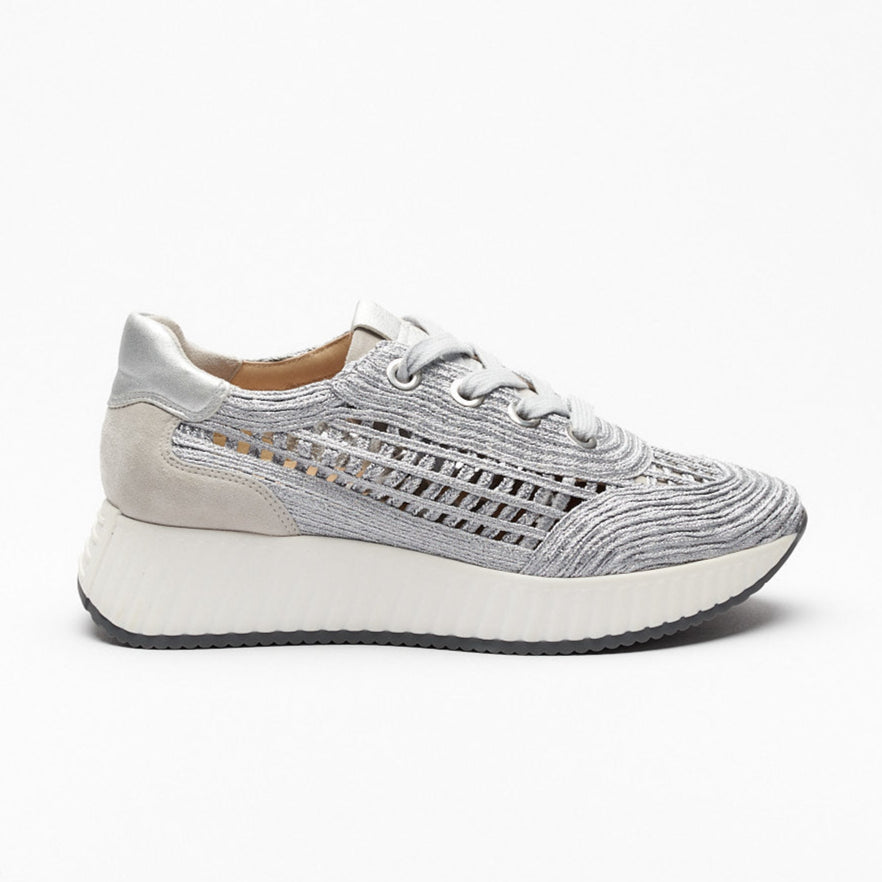 A pair of silver and gray Softwaves Alaina Rafia sneakers with a velour texture and a chunky sole.