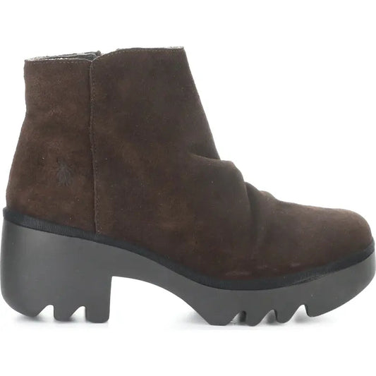 Brown ankle boot with a thick sole on a white background