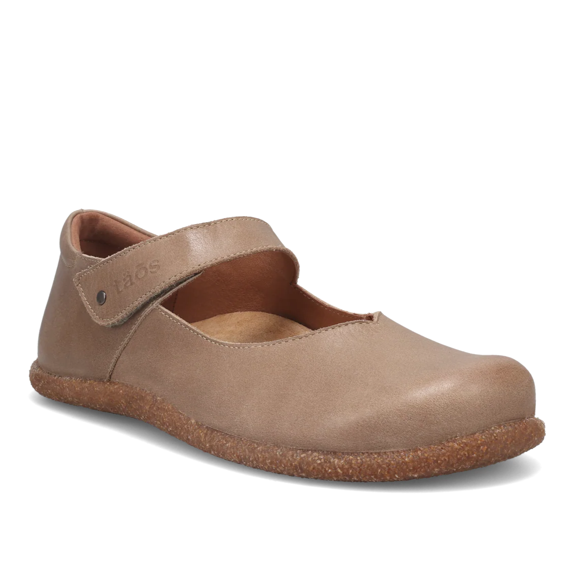 Beige shoe with brown sole on a white background
