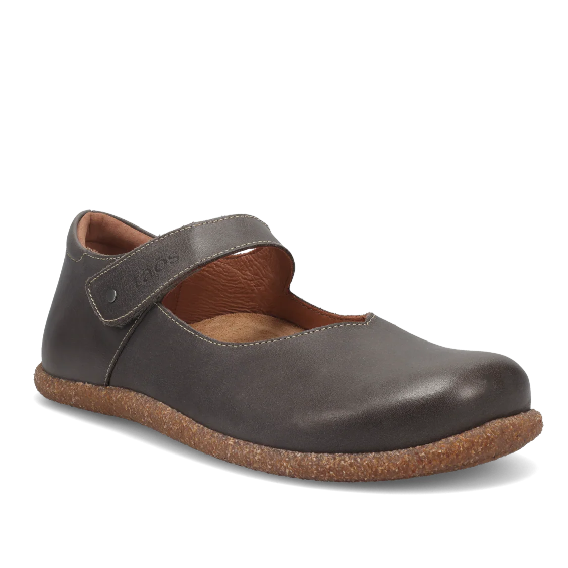 Brown leather shoe with cork sole on a white background